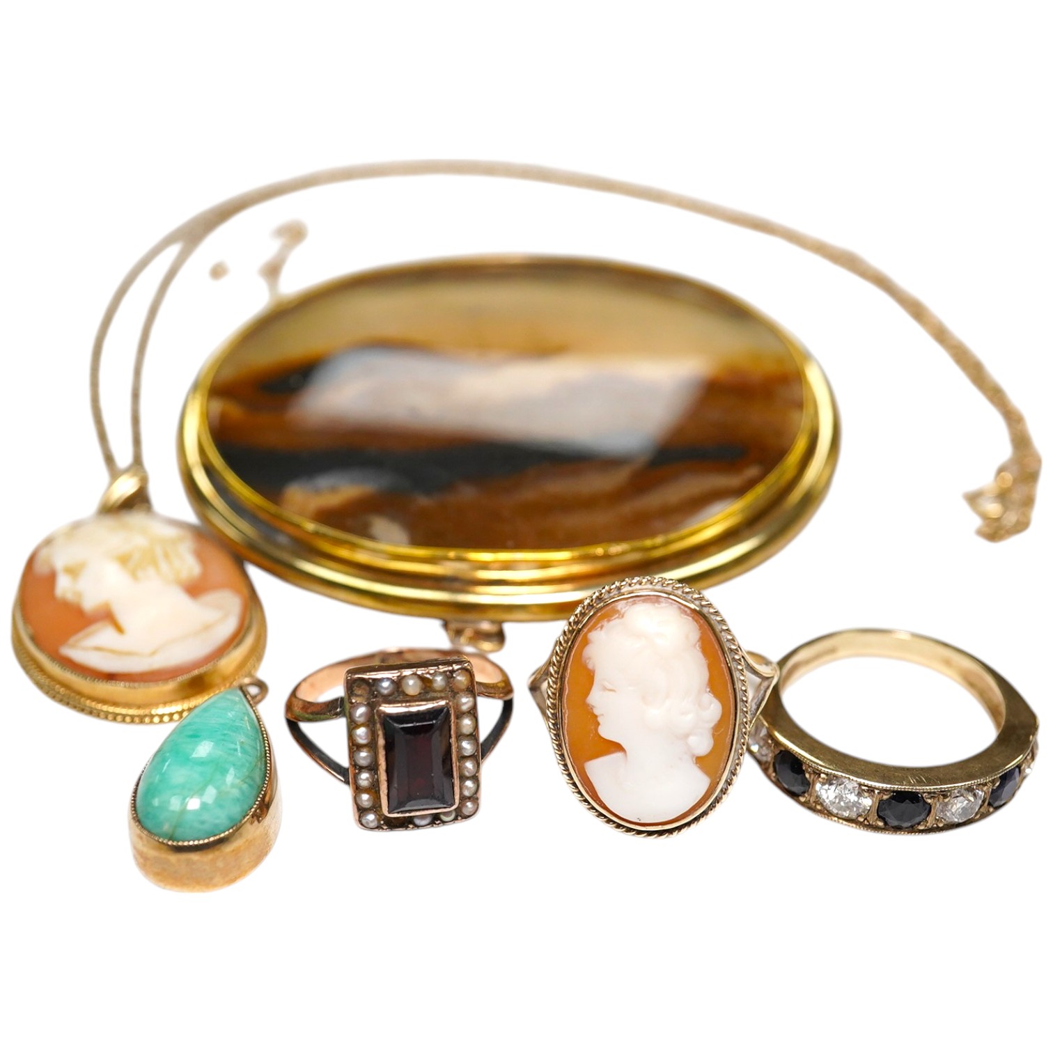 Three assorted 9ct gold rings, including cameo shell and sapphire and diamond half hoop, together with two pendants including 9ct mounted cameo shell on a 9ct chain and a yellow metal mounted agate brooch. Condition - po